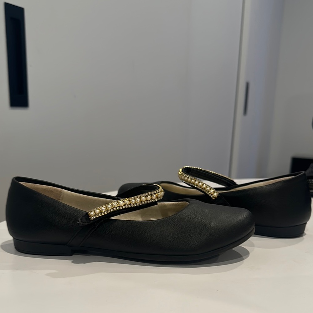 Chic Black Flats with Gold Accents